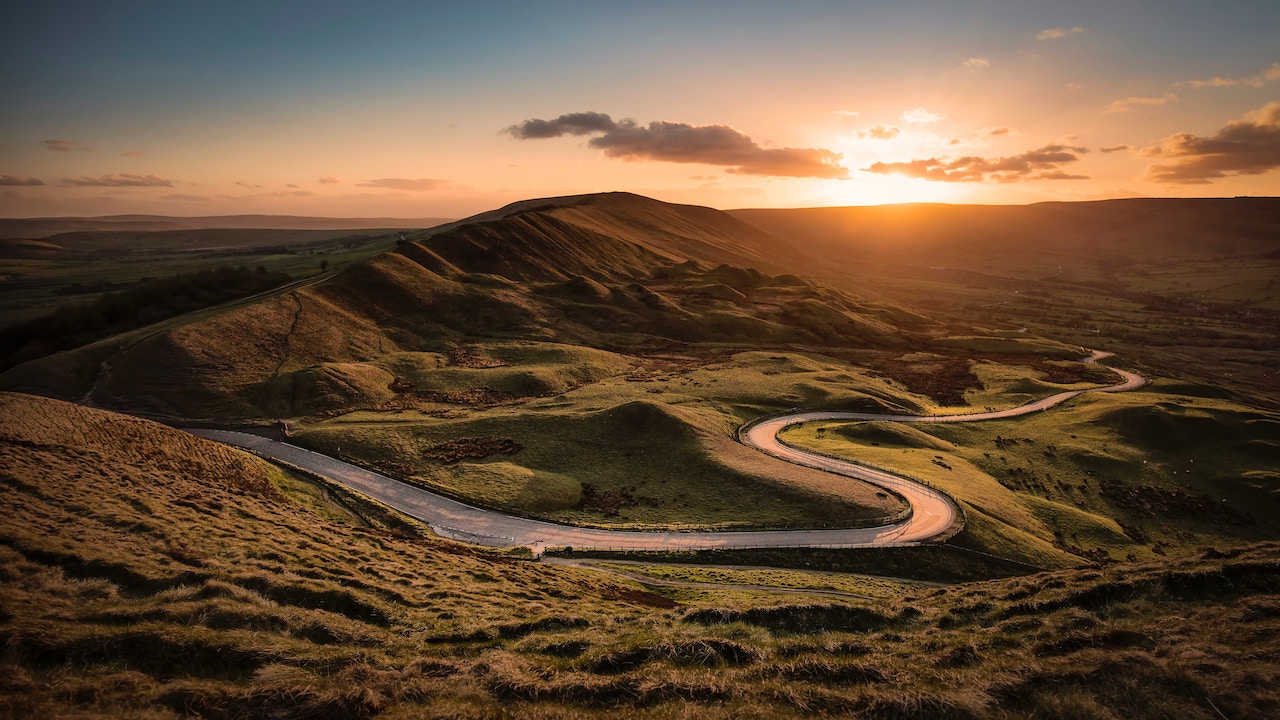 Sunset in Castleton Sunset over a winding countryside road in Castleton